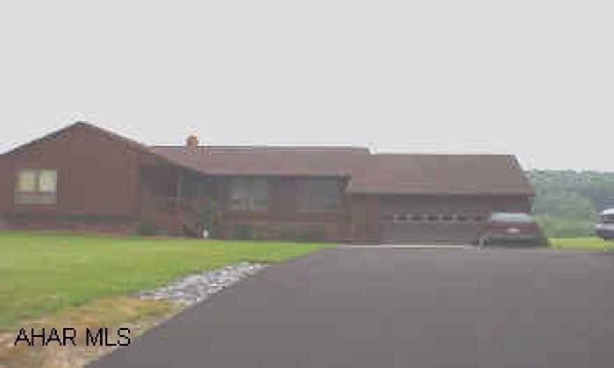 Kitchen has oak cabinets and desk, oak trim throughout house, central vacuum, security system,  laundry off garage, floors are ceramic tile and pergo. Property on right side of Scotch Valley Rd. 4.7 miles from Frankstown Rd. No sign.
