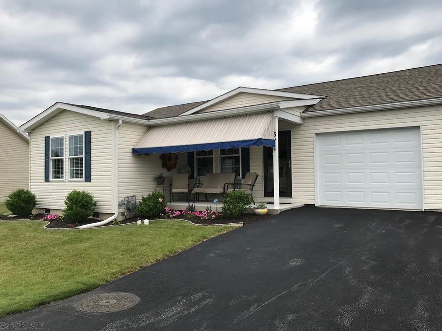 New Construction complete.  This home has been tastefully painted and decorated waiting for your furniture.  One Story living with an open floor plan for all your entertaining enjoyment.  Life is easy and carefree in this newer home with Large Laundry room, Master Bdrm and Master Bath, Hall Bathroom with upgraded vanity.  Second Bedroom is spacious for all your overnight guests.  Seller has installed unique lighting and ceiling fan.  Enjoy the amenities living in this 55+ Gated Community with Heated Swimming Pool, 2 covered patio areas to enjoy this summer, walking paths, Community Building with a work out room.  Reserve the Kitchen/Dining Room for all of your larger gatherings at no additional cost.  Life at its best!