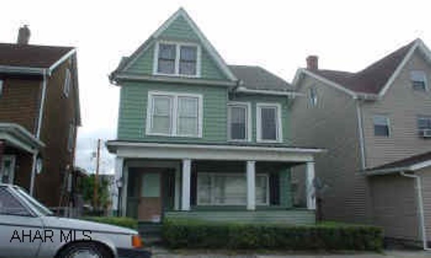 2 story. Needs some TLC. Good starter home or investment. AS IS.