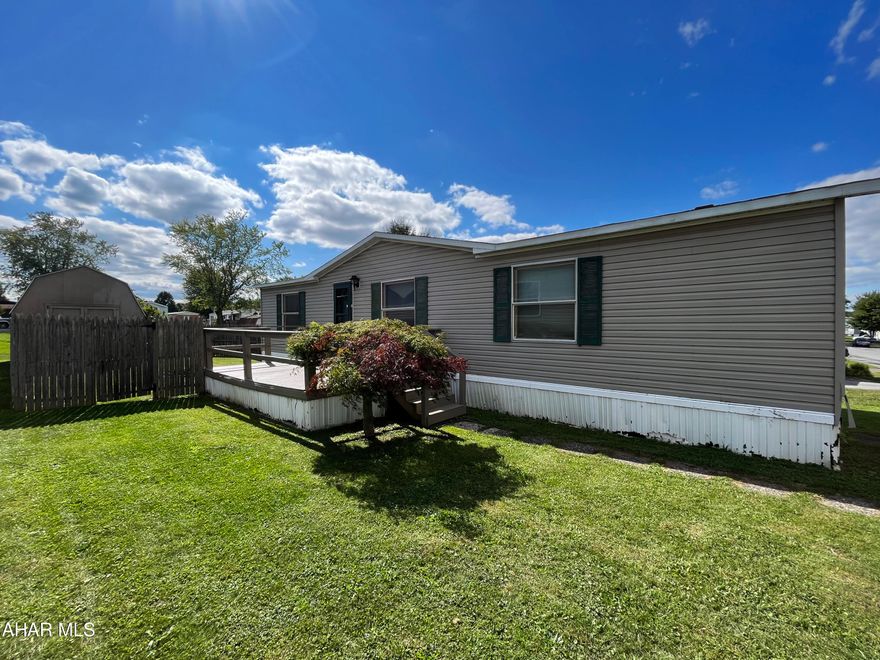 Nestled in the heart of Martinsburg, this magnificent Clayton double wide will have you feeling right at home. You will find yourself anxious to dabble with your culinary skills in the newly remodeled, spacious kitchen with ample cupboard space! You will enjoy time with those close to you in a fresh, open living room or in your front yard. With 3 bedrooms and 2 full baths, you can comfortably house a family or use the extra space for a craft room, office, or home gym. Find yourself within walking distance of Henry's Pond, outstanding restaurants, shops, and businesses and a quick drive to the Altoona-Blair County Airport. The home has undergone improvements such as new windows, electrical work, and updates to the furnace.

This home is situated on a lot that is managed by Mobile Realty. Buyers must apply at https://gomobilerealty.com/. Please view rules and regulations.