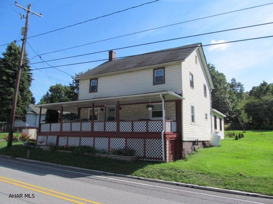 Spacious home on half an acre with large covered deck and wrap around porch, 2 sheds.