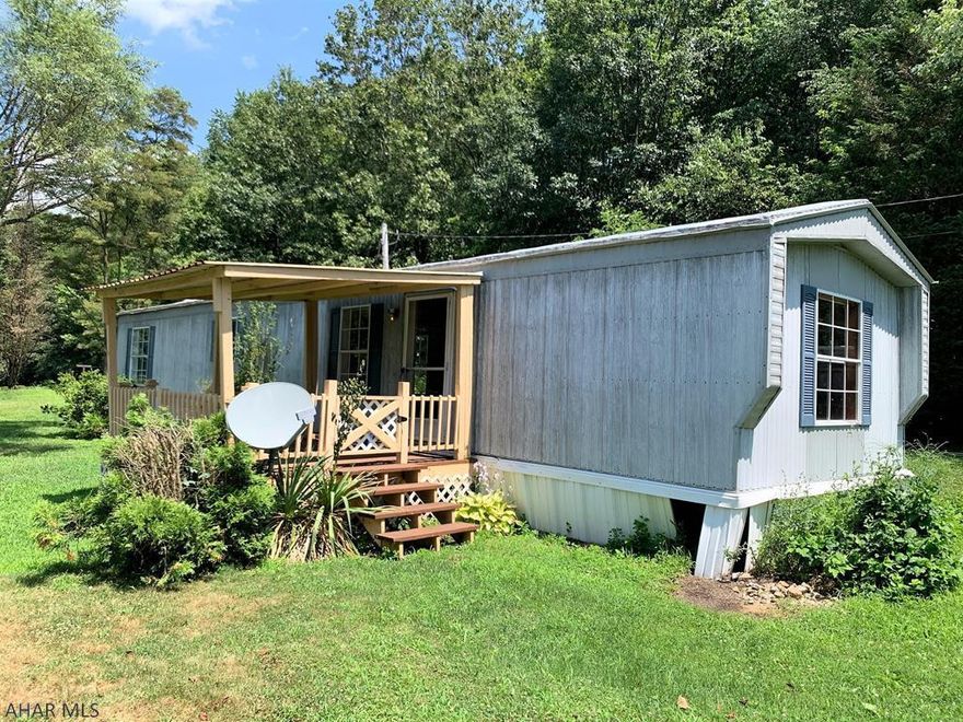 This single-wide mobile home rests on 1-acre of land just a few miles from downtown Bedford. It offers a living room, kitchen, two bedrooms and one bath. Oil forced air heat, 100-amp electric, a private well and a private septic. There is a large shed on site along with another storage shed. Nice rural setting with nice views!