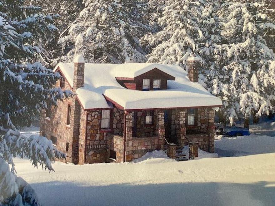 Come see this unique home in Central Cambria School District! This well built and well maintained stone home sits on a quiet 1.5 acres. Enter through one of the 2 lower level doors to the cozy family room with pellet stove fireplace. The partially finished basement also includes a laundry area and a full bath. You will also find plenty of storage and the utility room. On the main level you will walk into a well equipped kitchen with a walk out to the covered porch. Entertain in the large dining room and relax into the cozy living room overlooking the wooded backyard. Office area off the living room with 1 bedroom and full bath finish off the main level.The second level is large enough to make 2 more bedrooms if needed. This home is so unique, it is a must see!  Call for you showing today!!