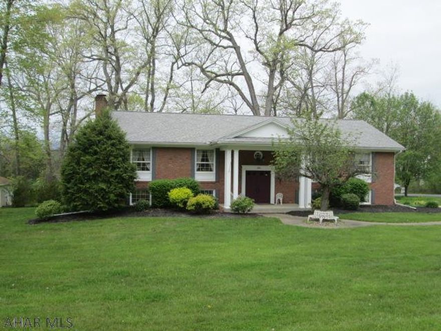 The gateway to Hollidaysburg offers this all brick bi-level. This well built home features large updated kitchen, formal dining room and cozy rear sunroom. The house sale will include all appliances plus the pool table. The lower level family room features solid masonry gas FP.