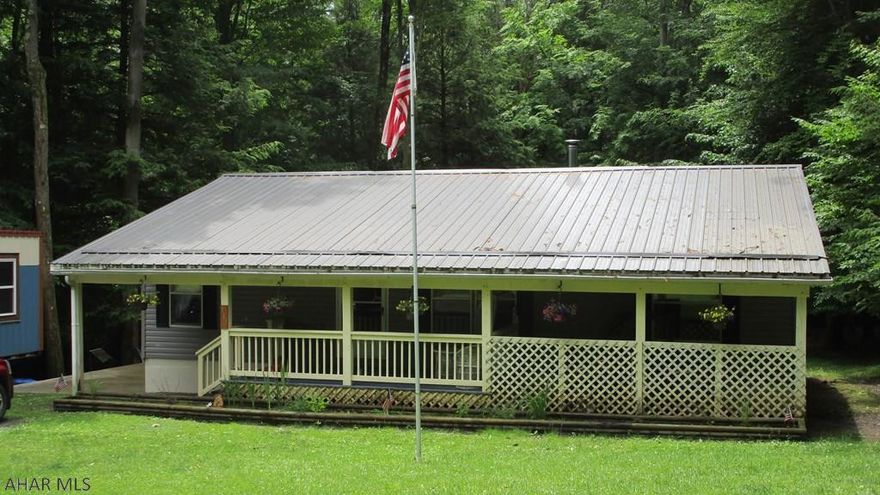 If you are looking for affordable country living look no further.  This three bedroom two bath double wide is located on just over a half acre on a private road in Glendale Yearound.  Sit on either the front or back porches and relax while watching the wildlife.  Master bath has garden tub.  The wood stove in the living room heats the home so well that you won't need to use much propane to heat this home.  Large back yard, partially fenced in for your children or pets.  Located in Glendale Yearound, a gated recreational development adjacent to Prince Gallitzin State Park / Glendale Lake.