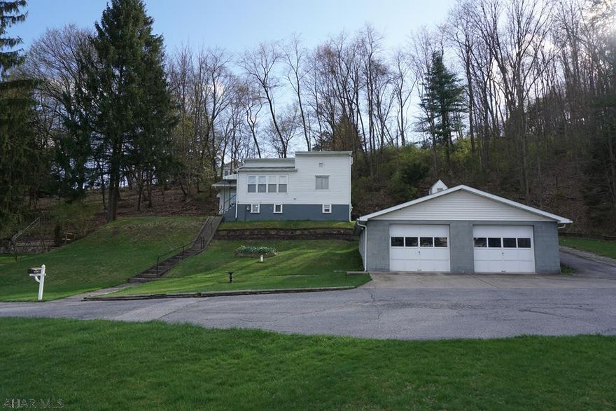 Wonderful 2 bedroom, 1.5 bath house on a great piece of property. Heated 2 car garage. Central air conditioning. Enclosed sun room. Very large yard!