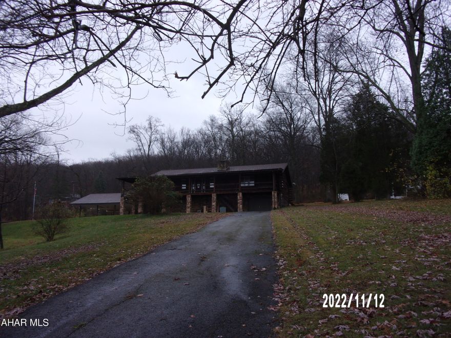 Convenient one floor living, roomy log home, tremendous views from wrap around porch and private outdoor space on rear deck.  One stall integral garage and three car car port plus ample additional parking