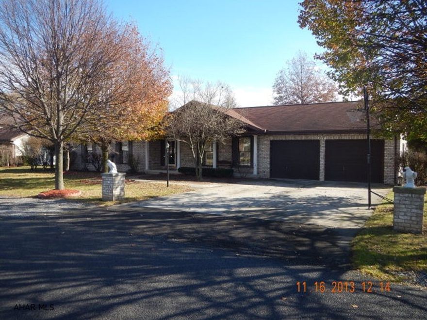 A move in ready brick house in the Woodland Terrace development.  3 Bedroom 2 bath house with a jetted tub in the bathroom. Large floor to ceiling windows.  A great outdoor heated sunroom lots of windows to let in the light, cable TV to this room.  A large separate building currently used as a fourth bedroom, could be an nice home office, has heat, carpet, electric,and cable. A gas fireplace in the family room with nice hardwood floors.  Very nice oak cabinets in the kitchen, laundry room off the kitchen. Central vacuum system. Central air, Full house attic fan.  Very nice vinyl fenced in back yard.  Very large two car garage, finished floor, wash sink, lots of storage. 8 X 10 storage shed. Full house attic storage.