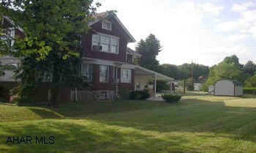 Large brick home on large lot in Blair Township. Perfect for office space or business. Plenty of parking. Large beautiful brick home in Blair Township. Beautiful woodwork throughout. Very large rooms. Two car garage has heat, air conditioning, and  bath.