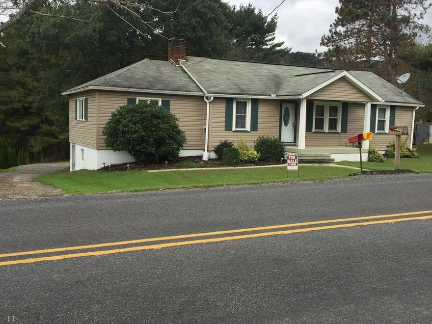 Maintained 3 bedroom ranch home on 1.75 ac. Newer large living room w/brick fireplace, full basement w/walk out & 1-car detached garage w/ workshop area. Has a private well & public sewer. Small stream to the back of property but house not in flood plain.