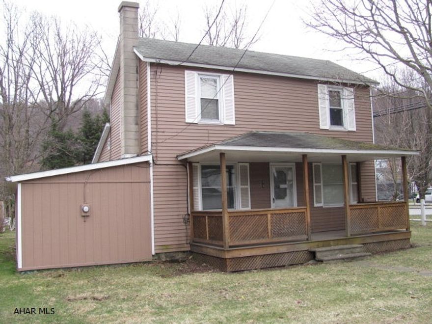 2 story aluminum sided home in Penns Manor school district. 2 car detached garage.
