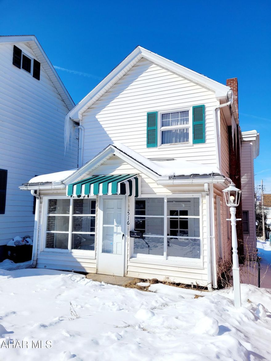 Quaint and affordable Altoona home for sale! On the first floor you will find a large living room and an eat in kitchen. There is brand new carpeting throughout the home! There is also an enclosed front AND back porch! The house is set back from the street just a bit, giving you the perfect opportunity for the cutest front garden you could dream of.  Upstairs, you will find two bedrooms, one bath, and a bonus area. The attic can be used for additional storage. Out back is a carport for an off-street parking opportunity! Don't wait, this cutie is priced to sell!