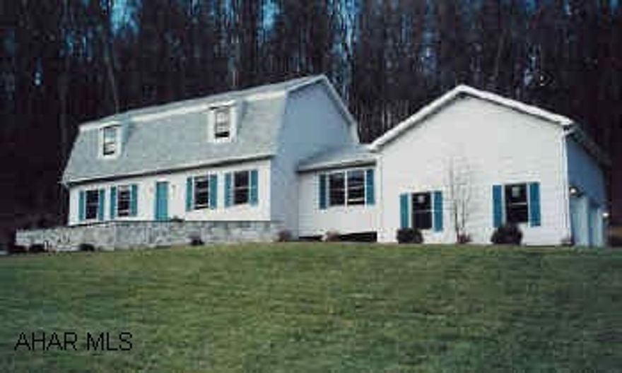 Large vinyl sided Dutch colonial on 15.863 acres.