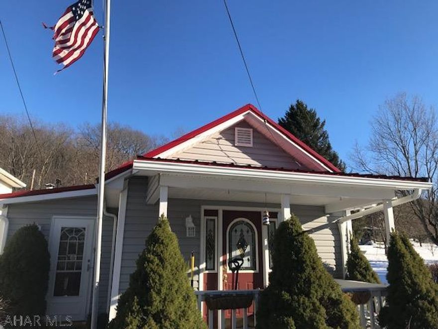 This is a charming well-maintained home that offers a living room with newer carpet, nice eat-in kitchen with new laminate floor, a family room/office,  2 bedrooms, 1 full bath, and a laundry room. The home has a metal roof, is nicely landscaped, with a little wooden bridge and a fish pond.  large garage with overhead storage, an office, and a 1/2 bath. This is a must see home! Perfect for just starting out or downsizing  for easy one-floor living.