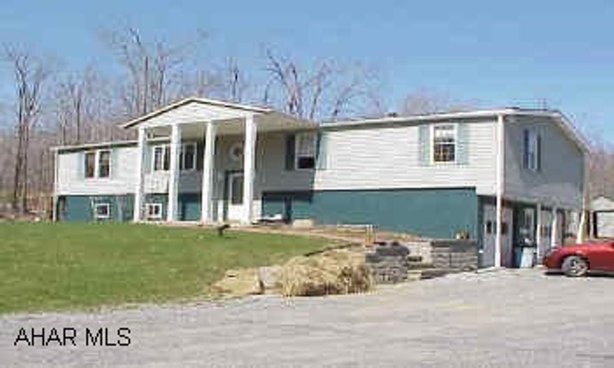 Great Double Wide totally remodeled, new windows ,oak kitchen, bathroom, siding, with  completely finished basement and 2 car interal garage.  30 x 60 pole barn.  Room for 2 box stalls, frost free tap, & 220 electric line.  Owner must sell / allowance for new garden tub.  No Showings Until May 2.