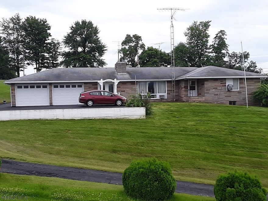 Nice 2 bedroom 1 and a half bath brick ranch house located in Breezewood.  Paved drive way with 2 car attached garage, wood burning stone fire place, pellet stove, appliances and an out side shed.  Make this your home!  MOTIVATED SELLER!!