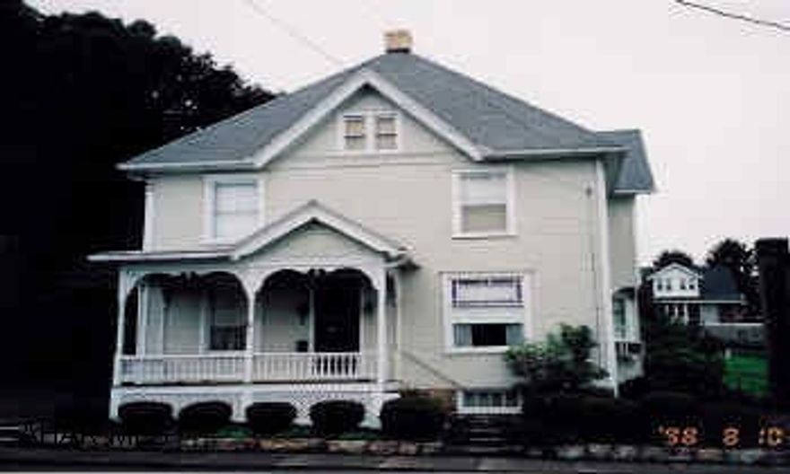 2-story 4BR 2BA home Lovely professional landscaping, in town convenience, off street parking, built-ins