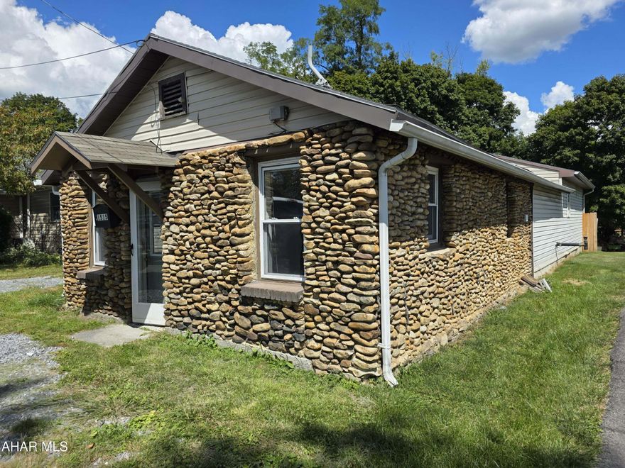 Stone-front ranch with fenced yard!
This home features a distinctive stone exterior and a fenced backyard with patio, fire pit, and storage shed. Inside, you'll find a spacious kitchen with painted cabinetry and plenty of counter space, along with two bedrooms and a full bath. Off-street parking is available along the side drive.
The property does need some work but offers great potential for the right buyer.