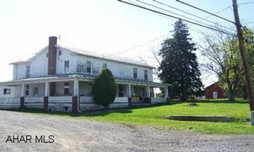 Large 2-story farm house on 3.8 acres with a barn and 5 additional out buildings. This large 2-story farmhouse originally built in 1860 is situated on 3.8 acres just minutes north of Bedford off I-99.  Features include an addition with a very spacious kitchen and newer oak cabinets and an eat-in area.  There are a total of 5 bedrooms, 1 1/2 baths plus one unfinished master bath.  Outdoor features include a barn and multiple outbuildings as well as fenced pasture.