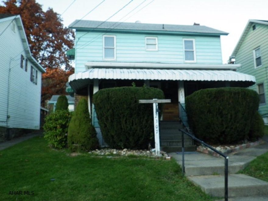 Well maintained 3 BR house. Modern kit with appliances. Eat-in kitchen with island, DR, LR, FR. 1 1/2 baths. Oil HW heat. Shed. Huge covered front porch