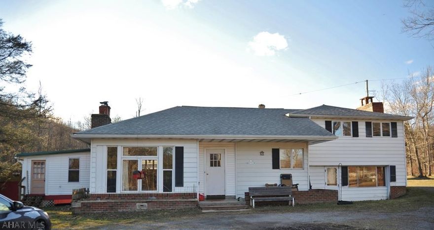 UNIQUE PROPERTY on 1.45 acres!!! This 4 bedroom, 2.5 bath house is perfect if you're are looking for country living yet close to town! Multiple outbuildings on property include chicken coop, dog kennel, garage with 3 bays w/ WORKSHOP! The workshop area would be PERFECT FOR ANY CRAFTSMAN!!! This is a must see! Schedule your showing today! (off of Rainspout Rd and rt 865) buyer to confirm taxes and sq footage of house and land