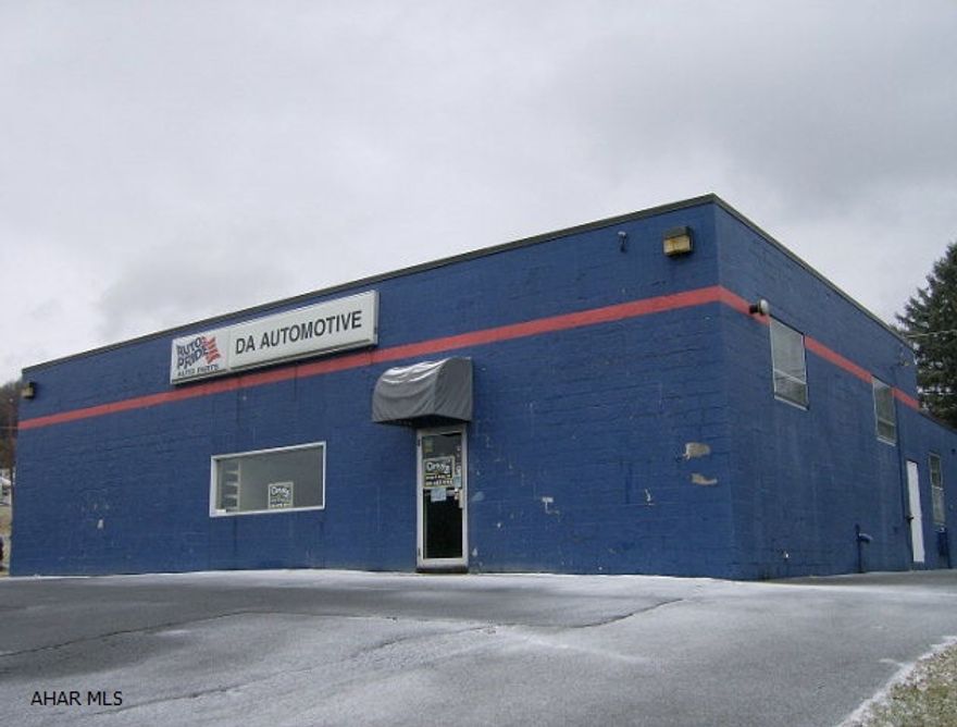 Nearly 3,000 sq ft commercial building, formerly automotive store on corner lot, with plenty of parking. Many possibilities $89,900 Possible rent to own to qualified buyer.