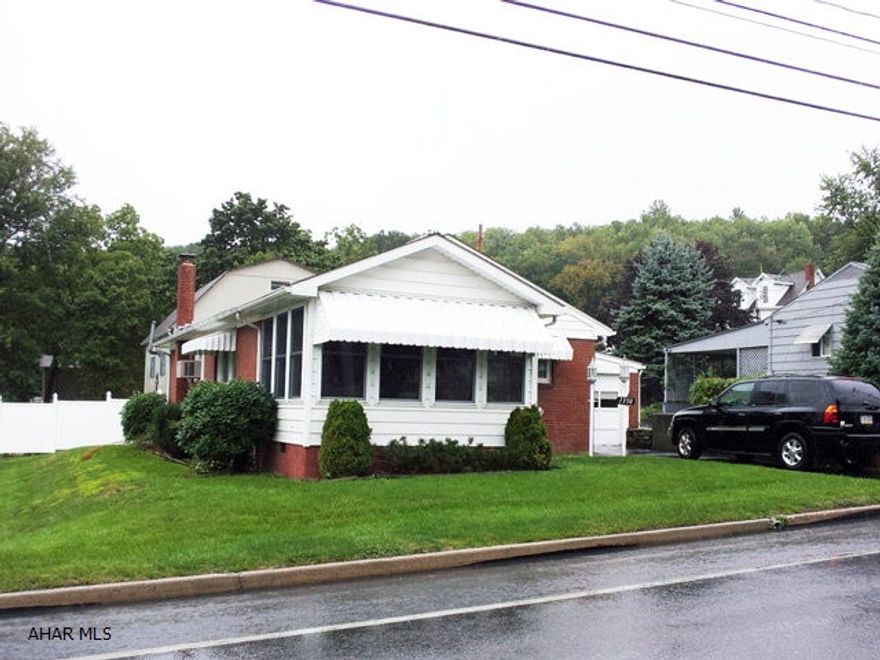 Cozy 2 bedroom brick rancher with 1 car attached garage. Enclosed front porch. Family room in basement.