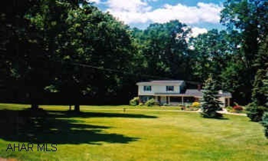 Brick and Cedar, living room, formal dining room, family room with fireplace, eat-in kitchen with cherry cabinets, corian counter tops, hardwood floors, plaster walls, 3 zone GHW, finished lower level with ceramic floor, family room with parquet floors, kitchen, 3/4 bath, workshop, immaculate condition.  3.73 acres, 2 streams.  Built in oven range, microwave, dishwasher, 2 level brick patio.  2 car garage attached and 2 car garage detached.