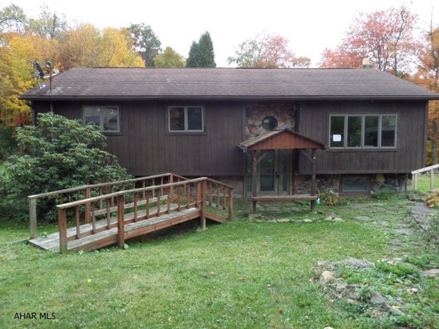 This 3 bedroom, 1 bath, bi-level home situated on 1 acre features hardwood floors and ceramic tile. Large eat-in kitchen w/ island.  Vaulted ceilings and sunroom gives this home an open floor plan. Plenty of room in the back yard for pets and kids to play. Some TLC and cosmetic repairs could make this your dream home. Buyer pays both transfer taxes.