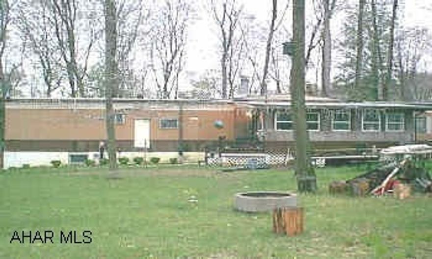 Nice 2 bedroom, 2 full baths wood burning fireplace in living room, 1 cargarage in basement, work room and a wood burning furnace,  also oilforced air heat on approx 1/3 acre in glendale yearound. All for 23,900.