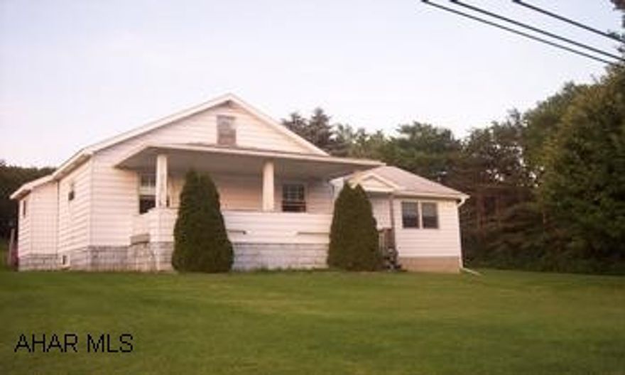 Lovely 1 1/2 story home situated on 5 acres!  Tax ID#  49-001-115 Map - 49-66-335 Ctrl. Lovely 1 1/2 story home situated on 5 acres!  Large sunken living room addition with corner propane fireplace.  Generous room sizes.  New windows throughout.  Walkup attic for storage.  Outdoor wood & coal burning furnace for low cost heating as well as oil furnace.  2 Sheds on property.  City water but also has 2 wells on the property.  Very near state game lands and still only 30 mins. from Altoona and Clearfield.  Currently has holding tank, but city sewage is coming thru in spring 2010.  No Mineral Rights being conveyed.