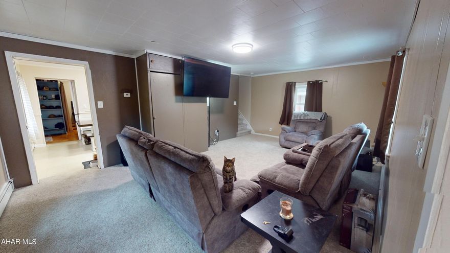 Welcome home! This home has been beautifully updated and is ready for you to move right in! Spacious living room with lots of natural light. The eat in kitchen has plenty of cabinet and counter space for lots of home cooked meals! Bonus room on the back of the house has been converted into a large master bedroom. Enjoy the convenience of first floor laundry! Upstairs there are three additional bedrooms and a full bath. Many updates have been completed to this home, including a new front sidewalk, parge and painted foundation, rear patio added with retaining wall, updated switches and receptacles, new carpet, added gutters and downspouts and a newly remodeled bathroom! You arent going to want to pass up on this beautiful home!