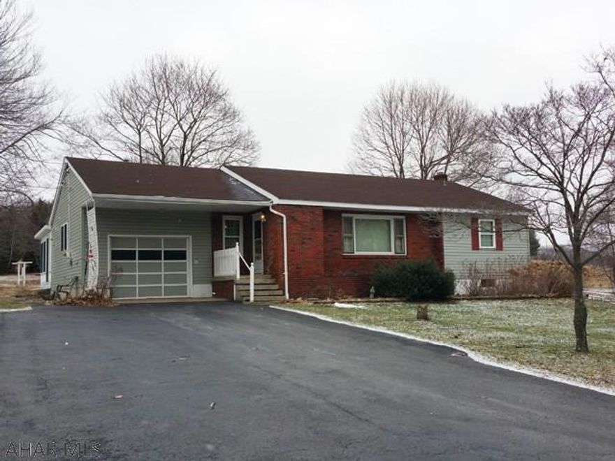 Nice 3 bedroom rancher with updated kitchen on 2.78 acres. Hardwood floors. Heated sunroom. 1 car attached garage.