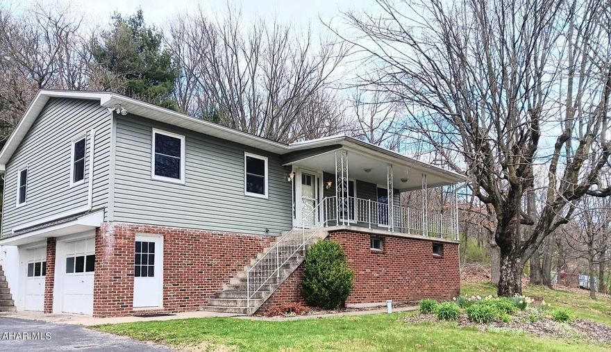 Say yes to this address! Check out this raised ranch in Duncansville with picturesque views on a large lot that is almost an acre and a half. Home features 3 bedrooms as well as two full baths and parking in garage for 1 car. In addition property includes expansive parking suitable for multiple vehicles.  This residence features many updates such as newer roof, siding, windows, and doors. Home features spacious finished downstairs family roof perfect for entertaining. This property includes 2 covered porches and back porch features newer hot tub that will make you feel like your on vacation even though your in the 16635 zip code!  Home includes Mini splits for cooling and home features multiple heating sources! Priced to sell! Call for your tour!