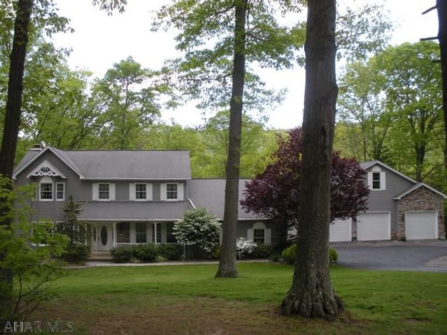 Don't miss this beautifully maintained home nestled on 1.3 treed acres in Sinking Valley. This home offers 3 bedrooms all with new carpet, a master with walk in closet, newly renovated master bath with jet tub, double vanity sink with granite top and seperate shower with glass doors. The main level welcomes you to a newly carpeted formal living room, family room with new carpet and gas fireplace, formal dining room with hardwood floors, cherry kitchen with newer appliances, breakfast bar and nook, 1st floor laundry and a den/office that could be a 4th bedroom. 5 garage bays, tons of storage, central AC, seperate barn with cold water and electric, new paver patio and more.