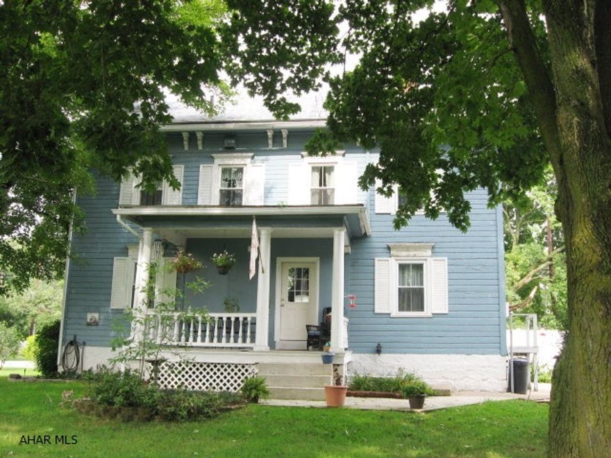 Charming home with large living rm with fireplace, hardwood floors, formal dining rm, updated kitchen. Above  ground pool with patio on a large, well manicured corner lot. High efficiencygas steam furnace, new windows with shutters.