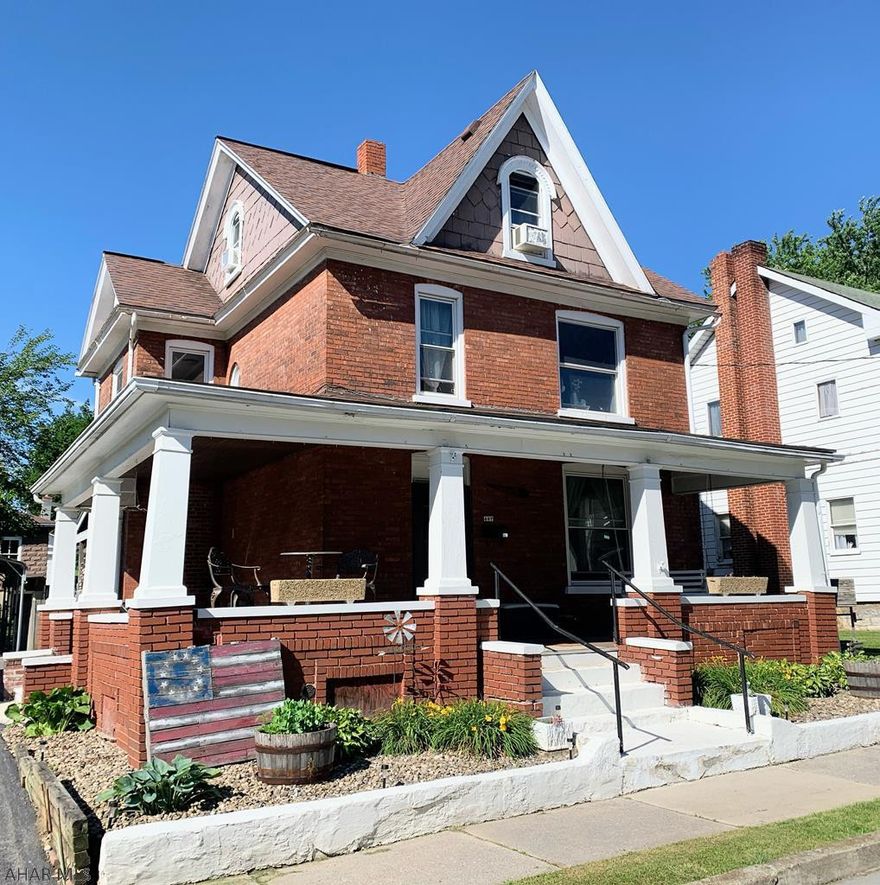 3 bed 1.75 bath Brick home with wraparound porch in Roaring spring borough with original woodwork, hardwood floors , freshly painted kitchen with subway tile backsplash and ceramic floors, dining area and living room with luxury vinyl flooring, propane fireplace and beautiful pocket doors. Small bonus room on 2nd floor that could be an office or a nursery. Large finished attic as 3rd  bedroom with walk in closet. Nicely landscaped large fenced in lot with firepit, swing set and pond. 1 car garage with a large workshop that is overtop of basement for additional storage and driveway with carport for plenty of off street parking. Shed. C/A.