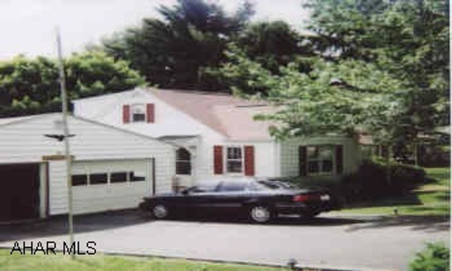 one & one half story vinyl , 4 bed, 2 bath, Lr, Dr, Kit,  hardwood floors 1st floor, fireplace Living room, 2 alternate heating units. family room basement