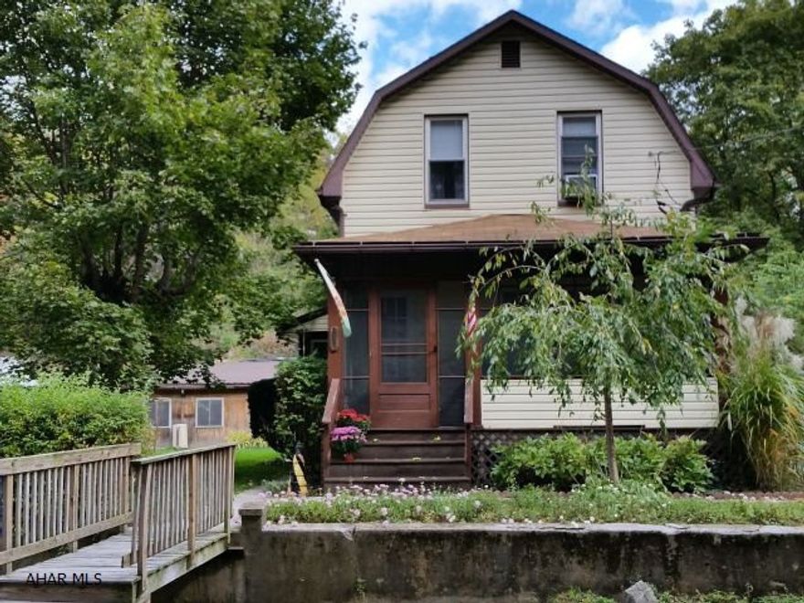 Nice clean vinyl-sided, 3 bedroom, 2-bath home with updated kitchen and modern bath. Features some hardwood floors and laminate flooring (in dining room and eat-in area of kitchen). Family Room in heated breezeway + screened front porch! 2 Car garage plus 2 bay carport. 3 Zone FitzutziElectric Heat Pump plus coal stoker hot water heat. Heat pump also supplies the air condition.