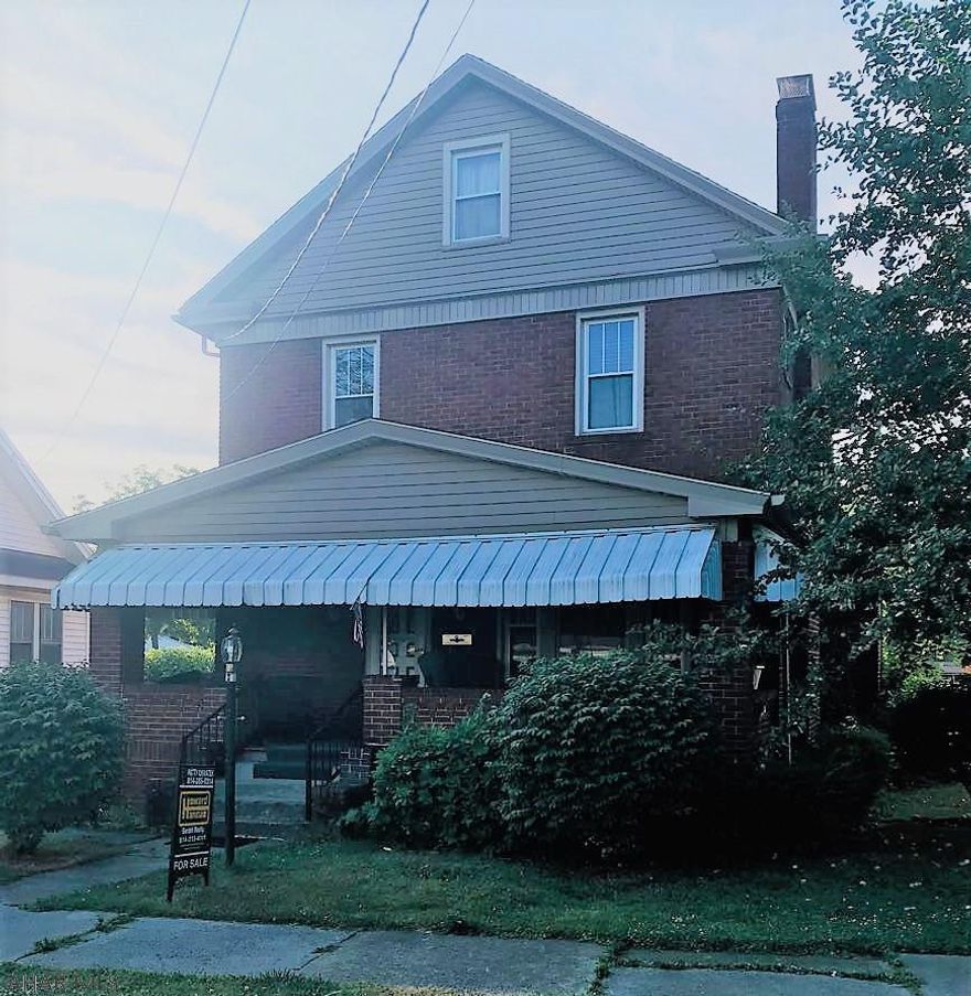Great brick home on a  49x122 level lot.  Large 8x24 front porch with swing.  5 bedrooms (2 on third floor)  Nice eat-in kitchen.  All appliances included.  Beautiful wood ceiling in Living Room with brick fireplace.  Newer windows & furnace. Hardwood floors under carpet!