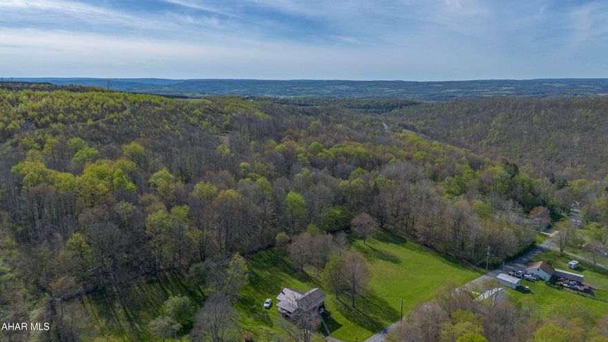 These stunning 13 acres offer the ultimate escape into nature, perfectly positioned to capture a magnificent view from the top of the hill.  Whether you envision building your custom dream home, establishing a premier hunting retreat, or simply creating a private weekend playground, this property provides unparalleled versatility.  The 1.3 acre site is already cleared and ready for construction.  Attention investors: with multiple potential build sites and the option to divide the property, these parcels present an excellent development opportunity. All utilities are available at the street. A large portion of the land is available for timbering. A beautiful stone wall adds character and charm to the landscape.
