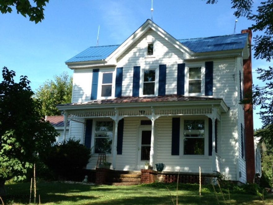 Wonderful country home on a quiet location of 2 acres.  Kitchen has been updated, has double doors from the living room to the porch for open living and entertainment. If you like country living you will love the the unique layout of this home. Includes a lg barn with stables and many possibilities.  The only downfall to this home is that you don't own it yet!