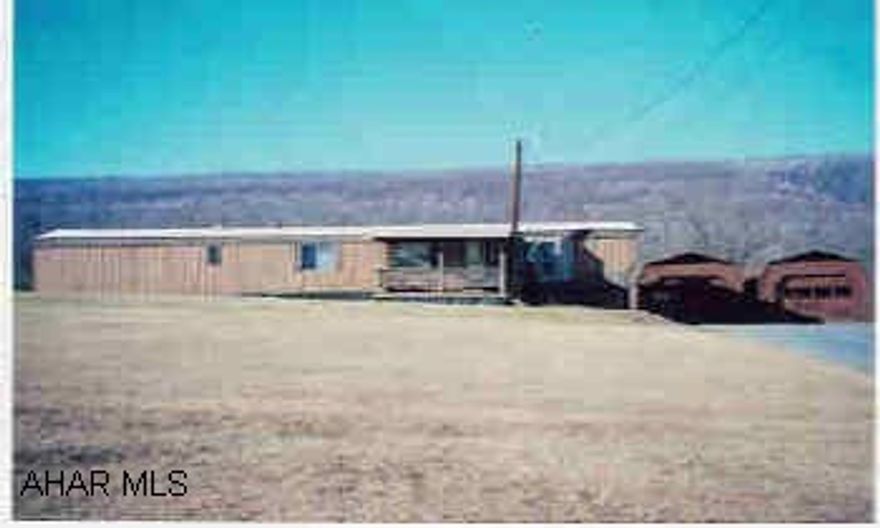 1987 Holly Park Mobile home on 1.5 acres with detached 2 car garage.