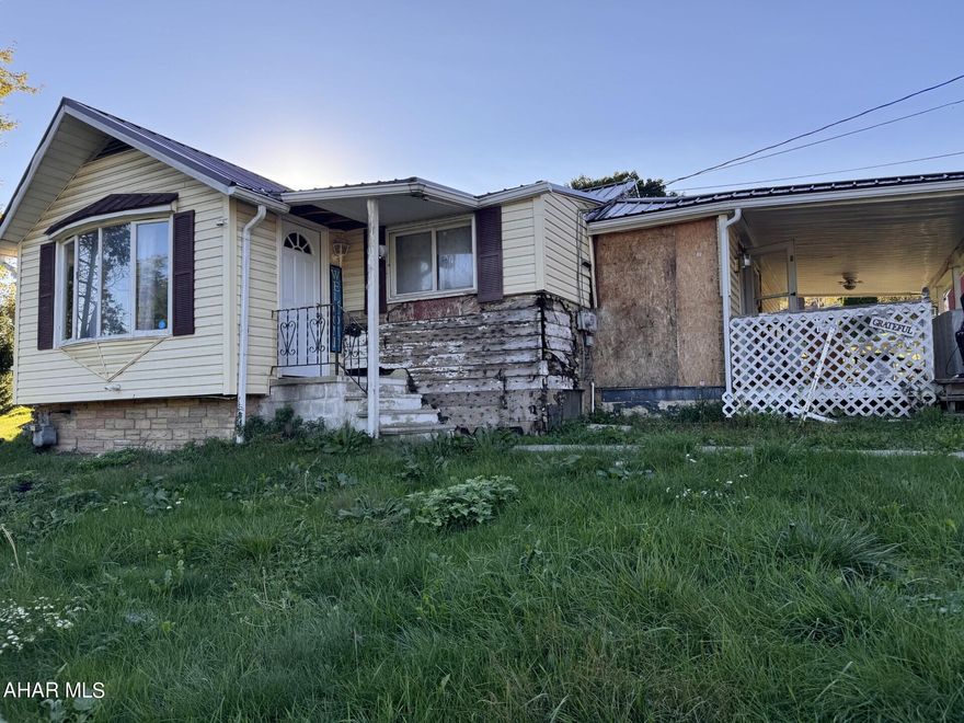 This ranch home sits on an irregular shaped 0 .5 acre lot in Portage Township. 4 bedrooms, one that is captive and 1 full bath. Nice sized living room. Enjoy the covered back porch all year long. Carport. Newer metal roof, newer furnace. In the process of getting sewer compliance certificate. Property being sold as is.