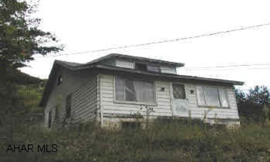 6 acres with 1 1/2 story frame home with aluminum siding, garage and barn. Turn off 220 by old Ames store, stay on road toward Tipton, property on the right.  Two adjoining parcels of ground.  l.48 ac with house and barn plus 5.23 ac parcel