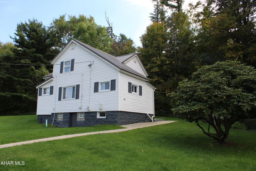 Come see this freshly updated, move-in ready home situated at the end of a quiet road. The house is nestled at the base of a mountain in a wonderful neighborhood. The nut and fruit bearing trees located on the property offer an array of wildlife viewing opportunities. The kitchen has brand-new countertops, and stainless steel appliances. There's a bonus room / den on the ground floor that could easily be converted into a 4th bedroom, if needed.  The lower ceilings in the home offer a cozy feel and reduced heating costs. The roof, hot water tank, and furnace have all been replaced in the past few years. There is also a detached 2 car garage and shed. Don't miss your opportunity to own such a great home! An extra parcel of land that is .33 acres is also available if interested for $13,500.