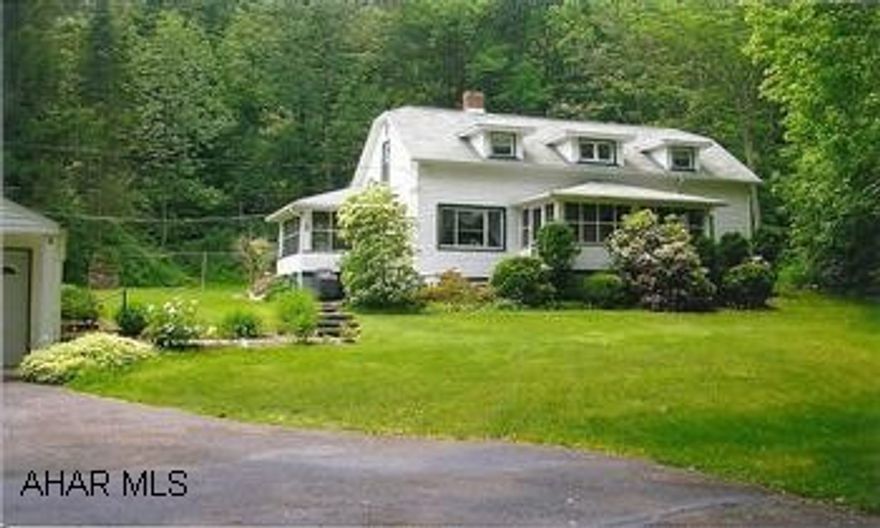 WHAT A SETTING!  GORGEOUS LANDSCAPING, VERY PRIVATE.  NEWER SIDING, ROOF, FURNACE AND WINDOWS.  OUTSIDE FIREPLACE, 2 SCREENED IN PORCHES.  CALL JOANN 935-8689.