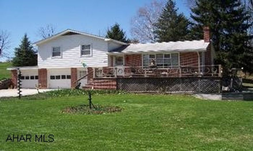 Two acres of pure country but close to all amenities!  This split level home has beautiful wooded views.  There are 3 bedrooms, 1 3/4 baths and a small addition could be a dining room or office.  Two car garage and walk-out basement.  The property has mature plantings and is fully landscaped.  There is even an orchard w/ pears, apples and cherries.  Sit on the deck and listen to the stream.  Call Colleen Fix to see at 814-623-8622.