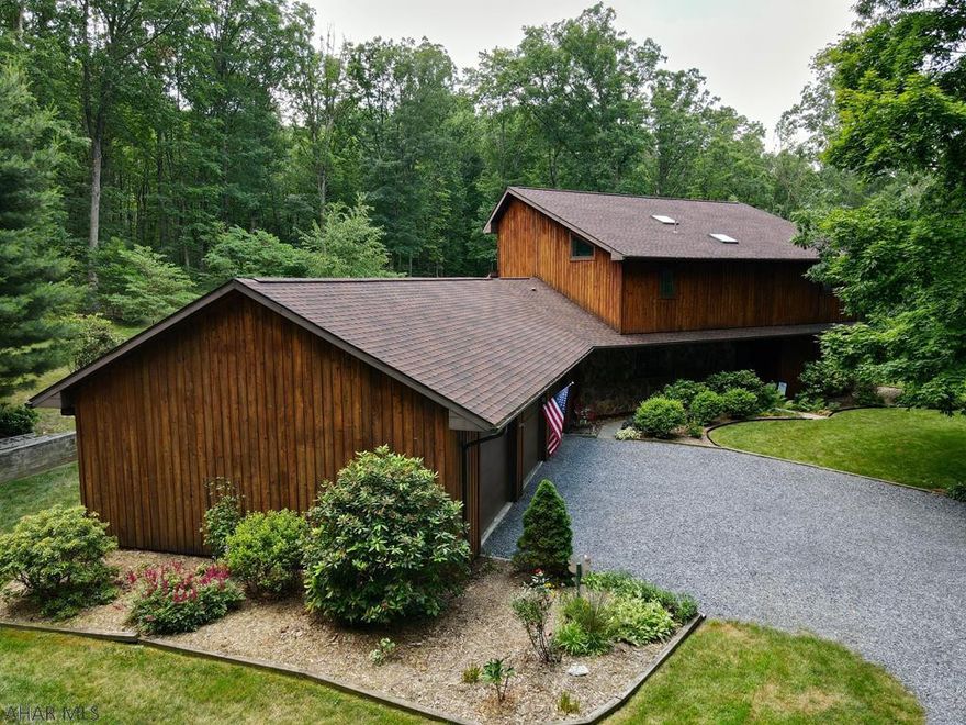 Now this is that home one dreams of coming home to & just relaxing while being surrounded by the sounds and sights of nature.  Southern exposure walls of windows & skylights ensure plenty of natural light & warmth while geo thermal heat ensures maximum energy efficiency.  Soaring cathedral ceilings in living spaces provide wonderful places to entertain & relax.  No expense was spared in creating 2 lovely master bedrooms with en-suite renovated bathrooms.  The wonderfully designed kitchen with tons of solid surface counters and storage will delight any chef.  The convenience of a first floor home office or bedroom with first floor laundry & 1/2 bath add convenience. Wheel chair accessibility from the oversized 3 car garage plus enjoy groomed walking trails and you will never want to leave.