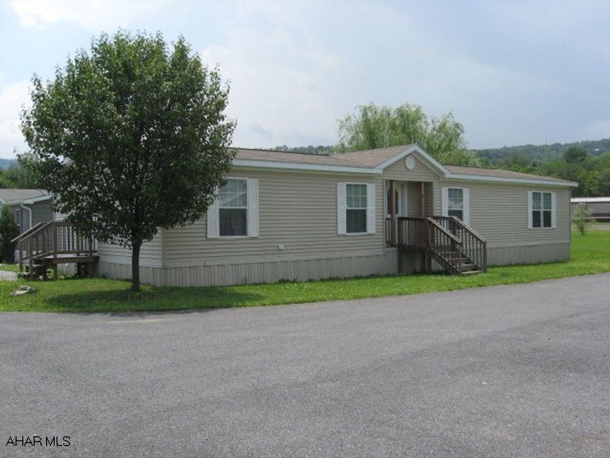 This well maintained (28x64) 2005 doublewide home boasts cathedral ceilings throughout, an open floor plan, office w/two built-in desks wired for computers, pantry & island in the eat-in kitchen, spacious master bedroom w/large walk-in closet, private master bath w/garden tub and free-standing shower w/dual seats.  Can stay (w/approval) or be moved.